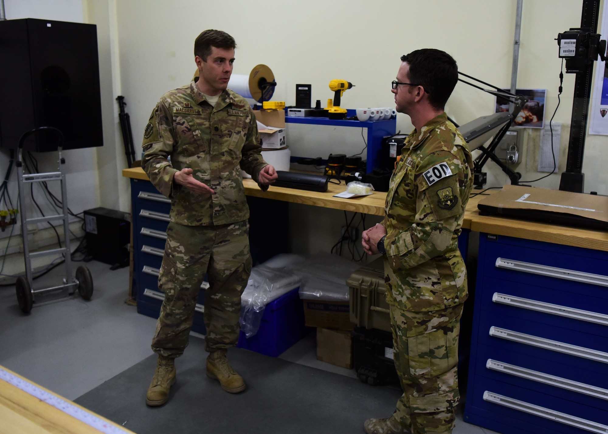 Lt. Col. Mason MacGarvey, 387th Air Expeditionary Squadron commander, speaks to Master Sgt. Michael Breive, explosive ordinance disposal technician, June 27, 2018, at Camp Arifjan, Kuwait. As a Joint Expeditionary Tasked Airman, Brieve provides his unique skill set and knowledge to the U.S. Army while still administratively attached to the 387th AES. (U.S. Air Force photo by Staff Sgt. Christopher Stoltz)