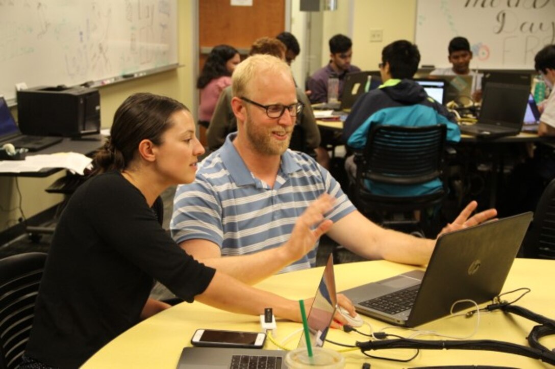 AFRL researchers Dr. Theresa Scarnati and Dr. Chris Paulson at a Wright State University workplace for summer interns with the Autonomous Technology Research Center. (Courtesy photo)