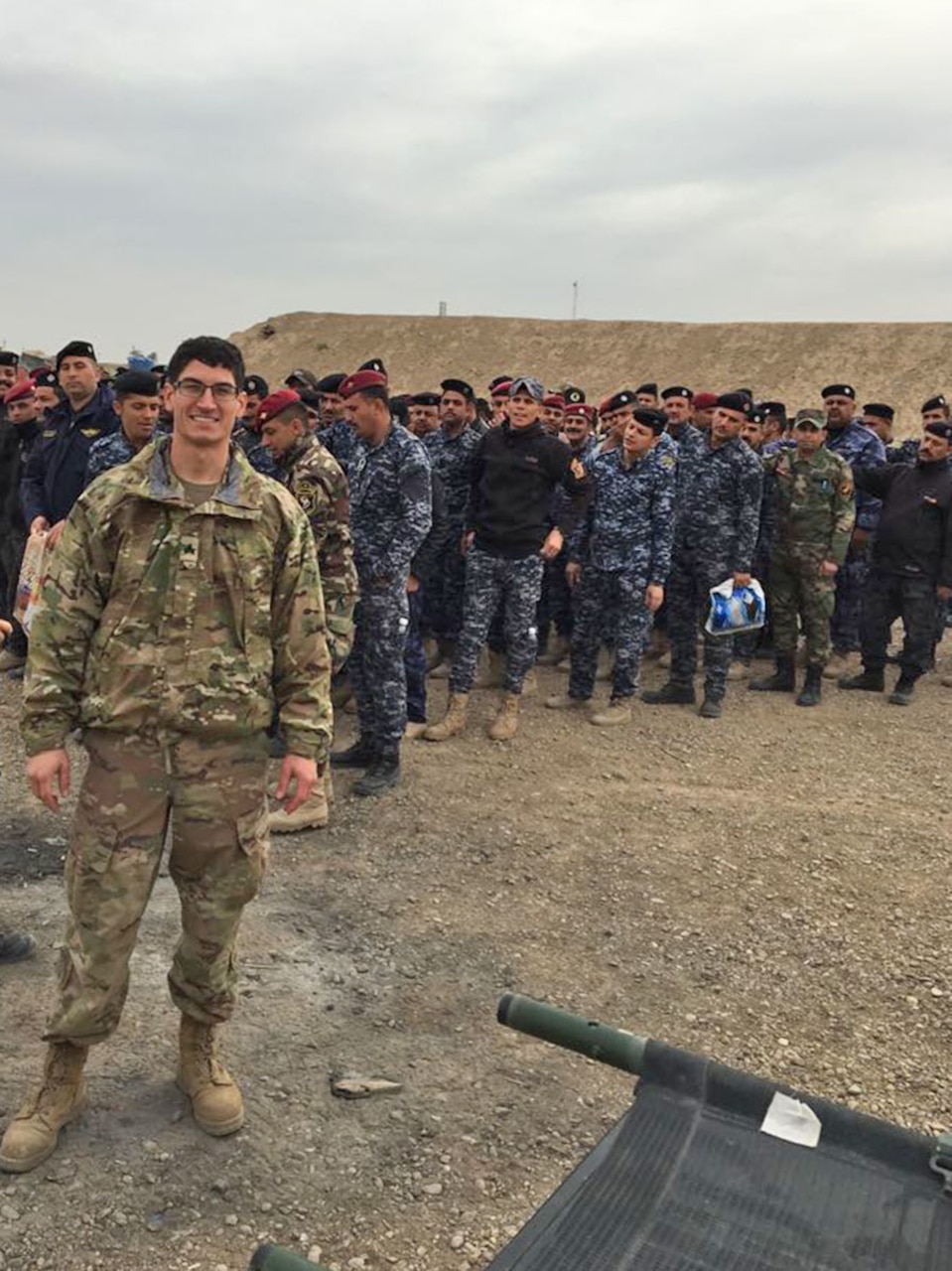 Soldier poses for photo in Iraq.