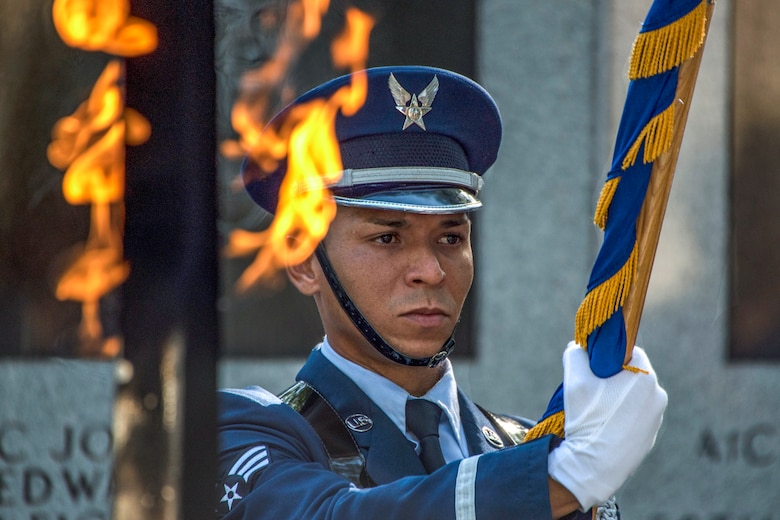 Senior Airman Teddy Ramos, base honor guardsman, presents the Air Force colors during the singing of the national anthem June 25, 2018, at Eglin Air Force Base, Fla. (U.S. Air Force photo by Staff Sgt. Peter Thompson)