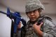 Airman 1st Class Valeri Chia, 88th Security Forces Squadron patrolman, reports her status, during an active-shooter exercise, Jan. 30, 2017, at Wright-Patterson Air Force Base, Ohio. The exercise was part of routine, periodic training to help provide a safe and secure environment on the base. (U.S. Air Force photo by R.J. Oriez)