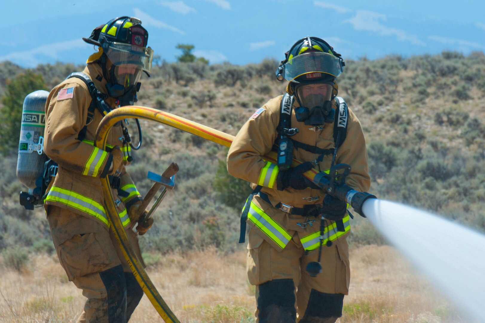 The 1157th Engineer Company (firefighters) from the Colorado National Guard conduct a training exercise to prepare for any real-world incident at the Spring Creek Fire helipad in Fort Garland, Colo., July 6, 2018.