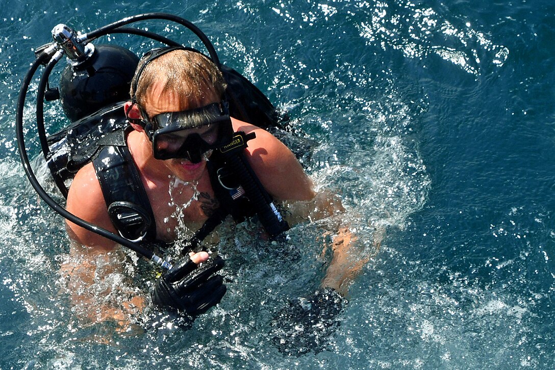 A U.S. diver surfaces following a training dive during exercise Resolute Response 2018.