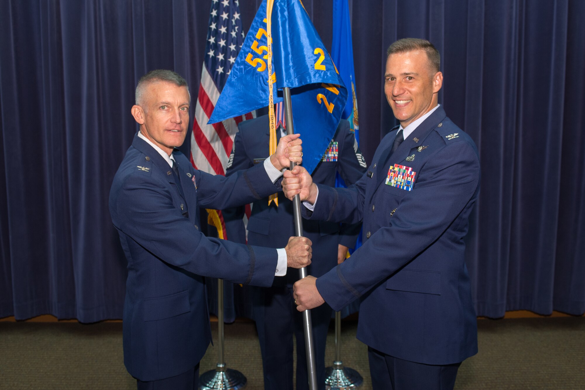 U.S. Air Force Col. Patrick Williams, 2nd Weather Group (WXG) commander, assumes command of the 2nd WXG from U.S. Air Force Col. Brian Pukall, 557th Weather Wing commander, July 11, 2018, at Offutt Air Force Base, Nebraska. 2nd WXG provides global, terrestrial, space and climatological environmental intelligence to the joint force, defense agencies, Department of Defense senior leaders, select members of the intelligence community, interagency partners and allied nations. (U.S. Air Force photo by Paul Shirk)