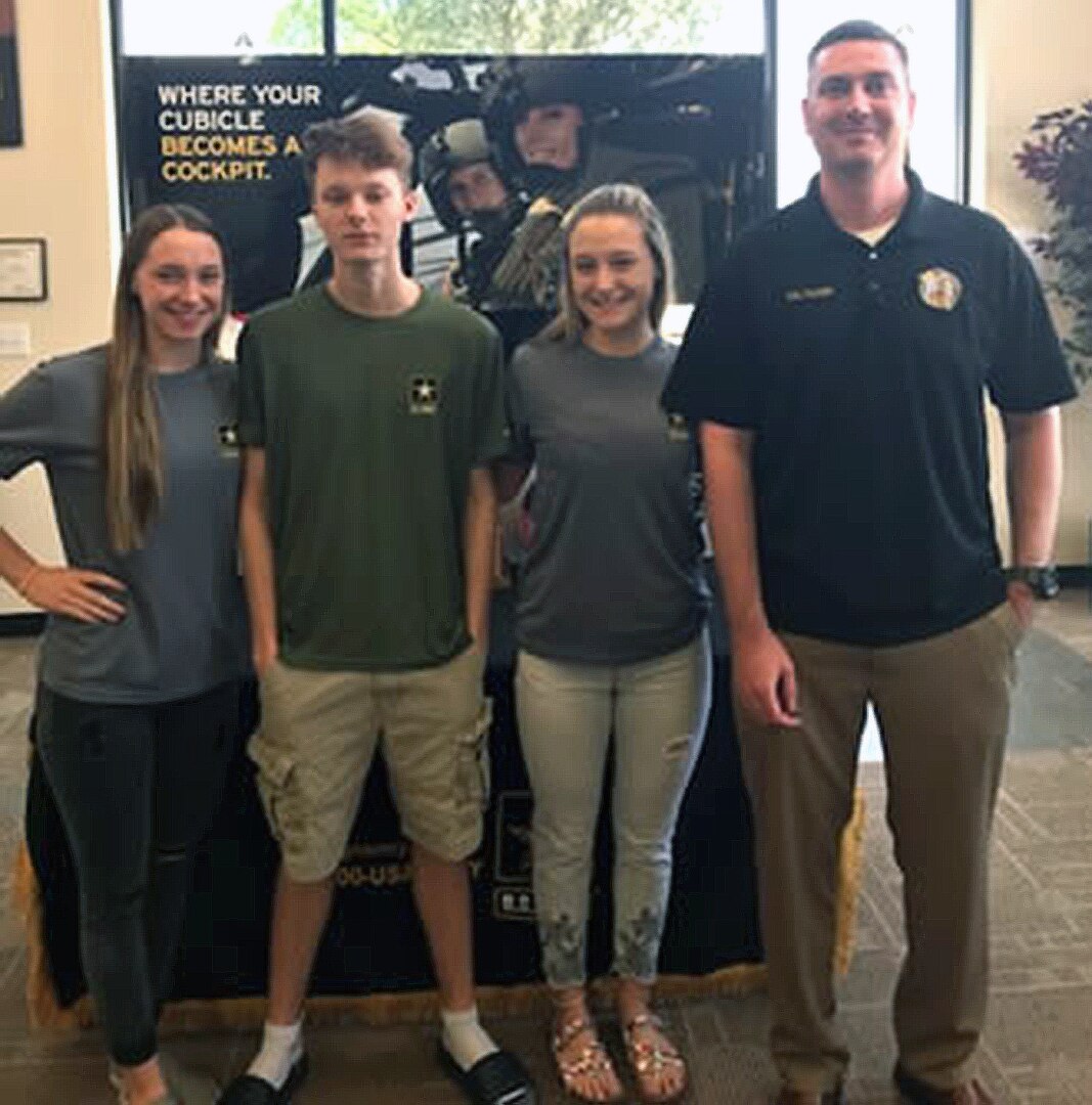 (From left) Triplets Kylee, Garrett and Madeline Mayfield at their Rolling Oaks Recruiting Station, San Antonio East Company, with recruiter Staff Sgt. Owen Tucker.
