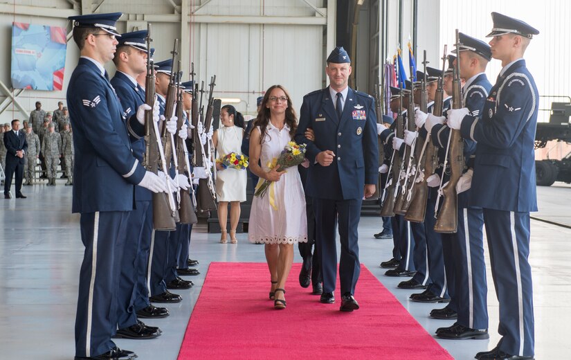 Col. Clinton R. ZumBrunnen, 437th Airlift Wing commander, departs with his wife Amanda following a change of command ceremony July 12, 2018, in Nose Dock 2.