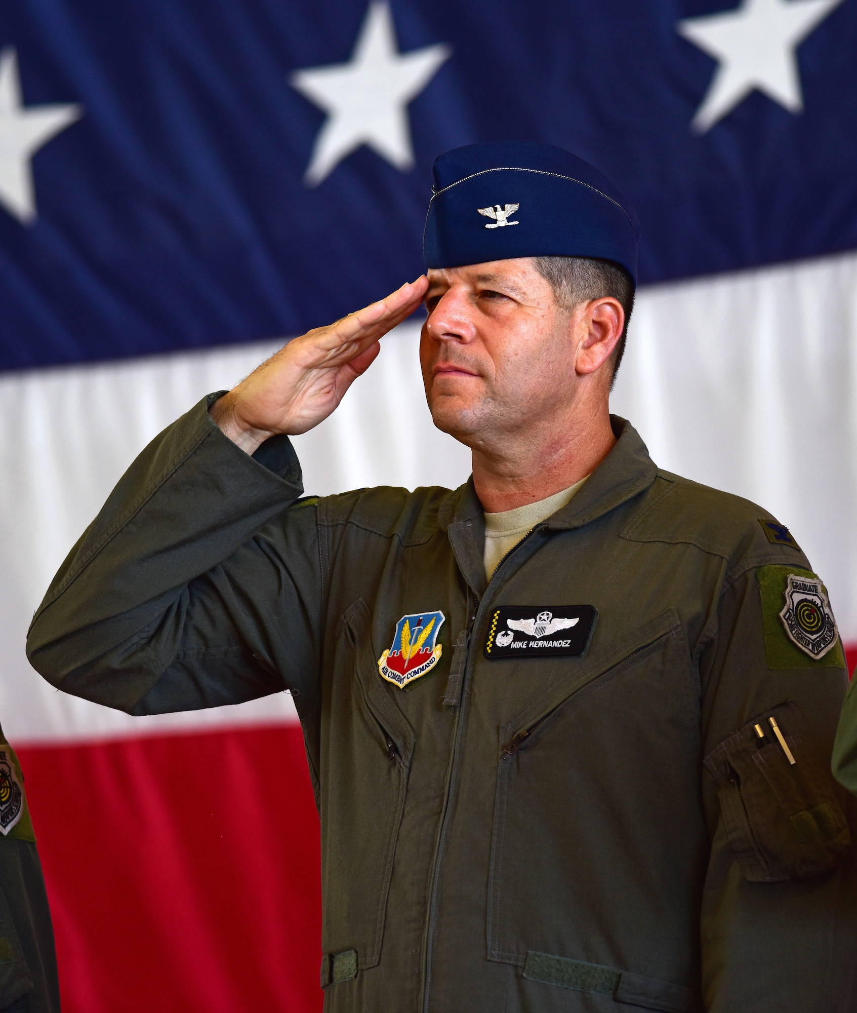 Col. Michael Hernandez renders a salute during the wing change of command ceremony