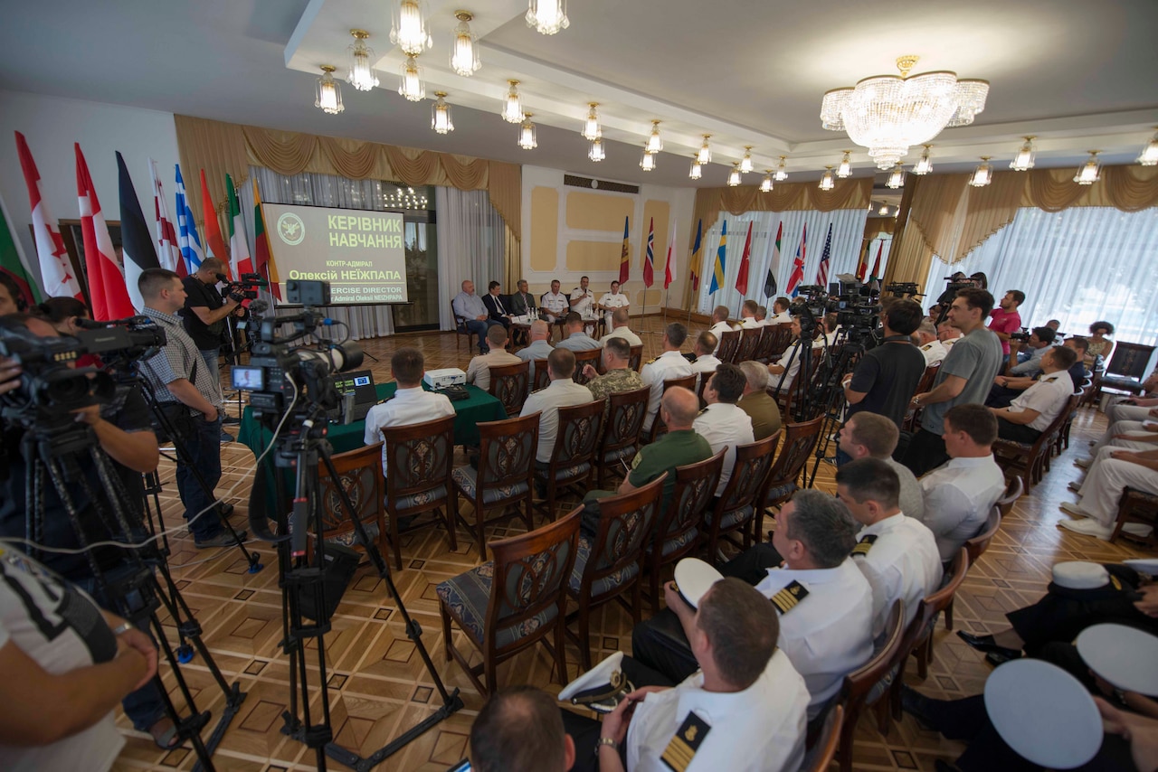 Ukrainian admiral briefs Exercise Sea Breeze participants.