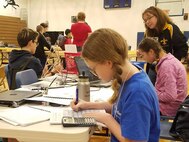 IMAGE: KING GEORGE. Va. (June 28, 2018) - A middle school student calculates the math required for a civil engineering activity at the 2018 STEM Summer Academy. The students briefed their mentors, teachers, and visitors on how they overcame a variety of Navy focused problems with STEM, creativity, communication, and teamwork throughout the week-long academy.