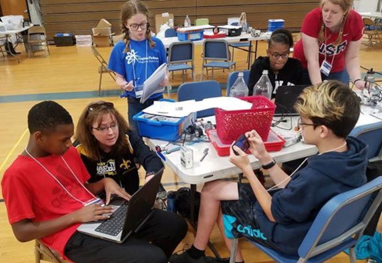 IMAGE:KING GEORGE. Va. (June 28, 2018) - Middle school students prepare for a science, technology, engineering and mathematics (STEM) activity at the 2018 STEM Summer Academy. The students briefed their mentors, teachers, and visitors on how they overcame a variety of Navy focused problems with STEM, creativity, communication, and teamwork throughout the week-long academy.