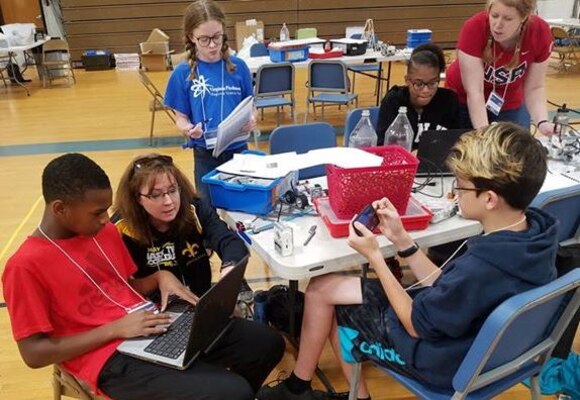IMAGE:KING GEORGE. Va. (June 28, 2018) - Middle school students prepare for a science, technology, engineering and mathematics (STEM) activity at the 2018 STEM Summer Academy. The students briefed their mentors, teachers, and visitors on how they overcame a variety of Navy focused problems with STEM, creativity, communication, and teamwork throughout the week-long academy.