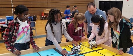 IMAGE: KING GEORGE. Va. (June 28, 2018) - Middle school students prepare to deploy robots they designed, built, and programmed to respond to 10 missions - including the delivery of humanitarian aid, rotating troops and transporting an electromagnetic railgun to the deck of a Navy ship - at the 2018 STEM Summer Academy. The students briefed their mentors, teachers, and visitors on how they overcame a variety of Navy focused problems with STEM, creativity, communication, and teamwork throughout the week-long academy.