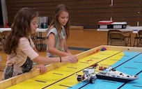 IMAGE: KING GEORGE. Va. (June 28, 2018) - Middle school students prepare to deploy robots they designed, built, and programmed to respond to 10 missions - including the delivery of humanitarian aid, rotating troops and transporting an electromagnetic railgun to the deck of a Navy ship - at the 2018 STEM Summer Academy. The students briefed their mentors, teachers, and visitors on how they overcame a variety of Navy focused problems with STEM, creativity, communication, and teamwork throughout the week-long academy.