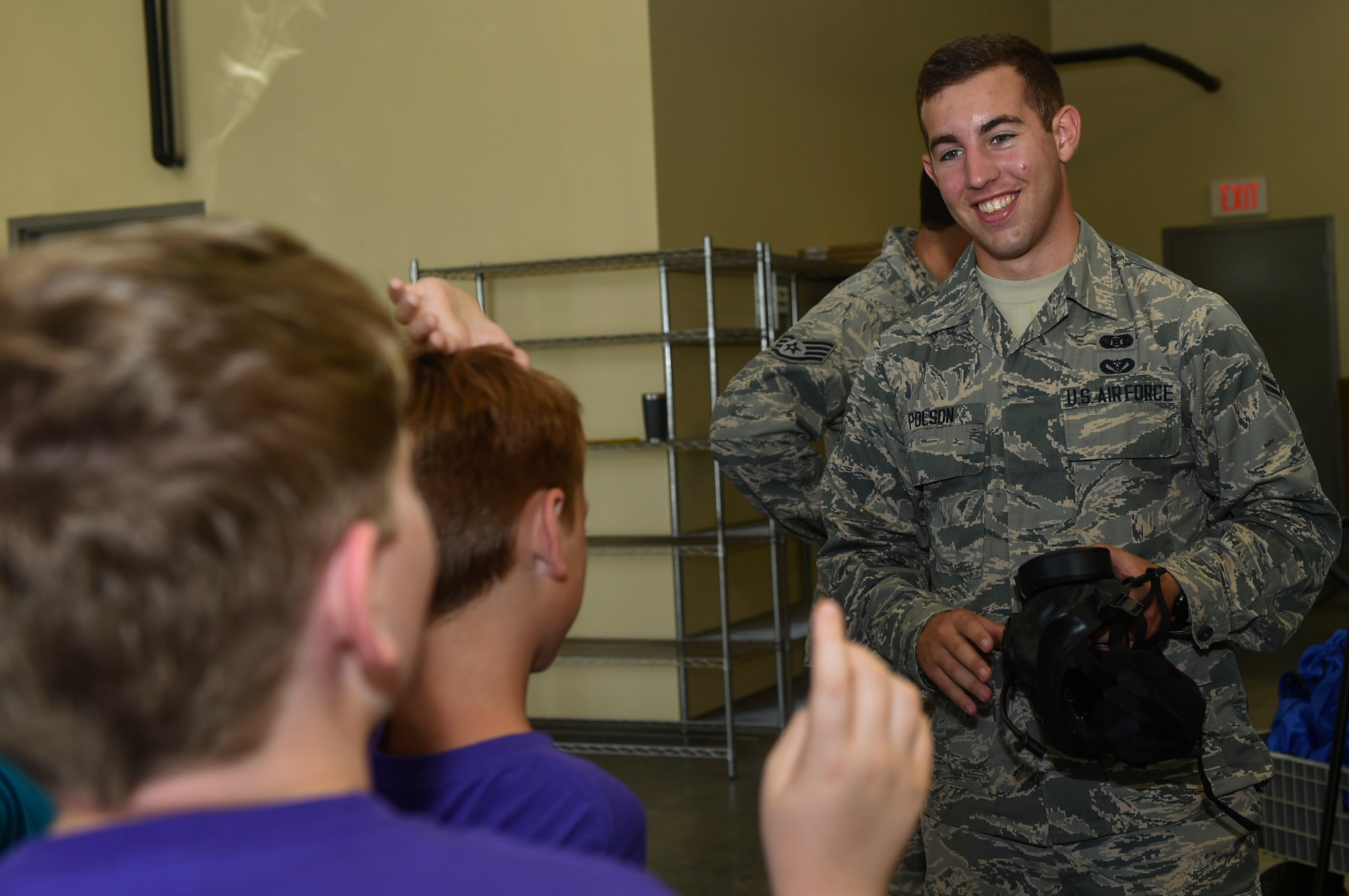 Airman 1st Class Cam Polson, 628th Civil Engineer Squadron emergency management operator, instructs students from the Joseph Pye Elementary School Summer Camp on the use of different tools and equipment for assessing and protecting from chemical incidents during a Science, Technology, Engineering, Art and Mathematics event July 12, 2018, at the emergency management building at Joint Base Charleston, S.C.
