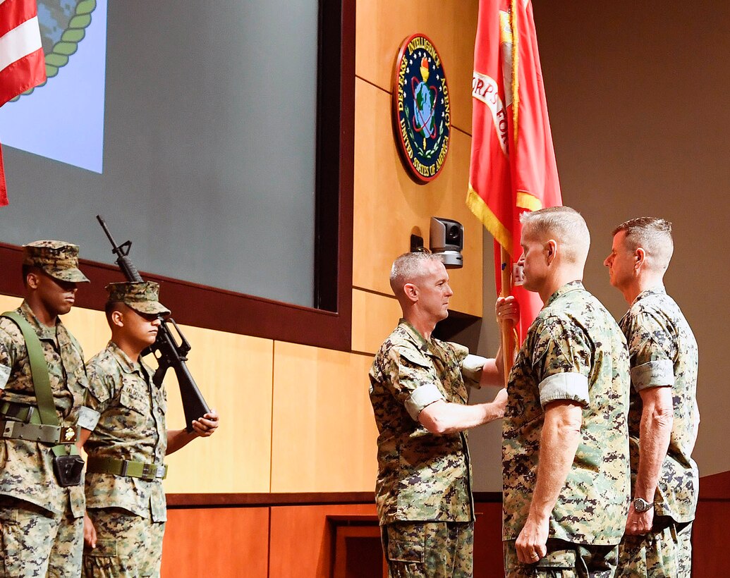 Sergeant Major William T. Thurber, U.S. Marine Corps Forces Central Command sergeant major, presents the MARCENT battle colors to Lt. Gen. Dave “Smoke” Beydler during a change of command ceremony at the Vince Tolbert Building at MacDill Air Force Base, July 11. Beydler, who has served as the MARCENT commander since Oct. 27, 2015, will pass the battle colors to Lt. Gen. Carl E. Mundy, III, representing the exchange of command.
