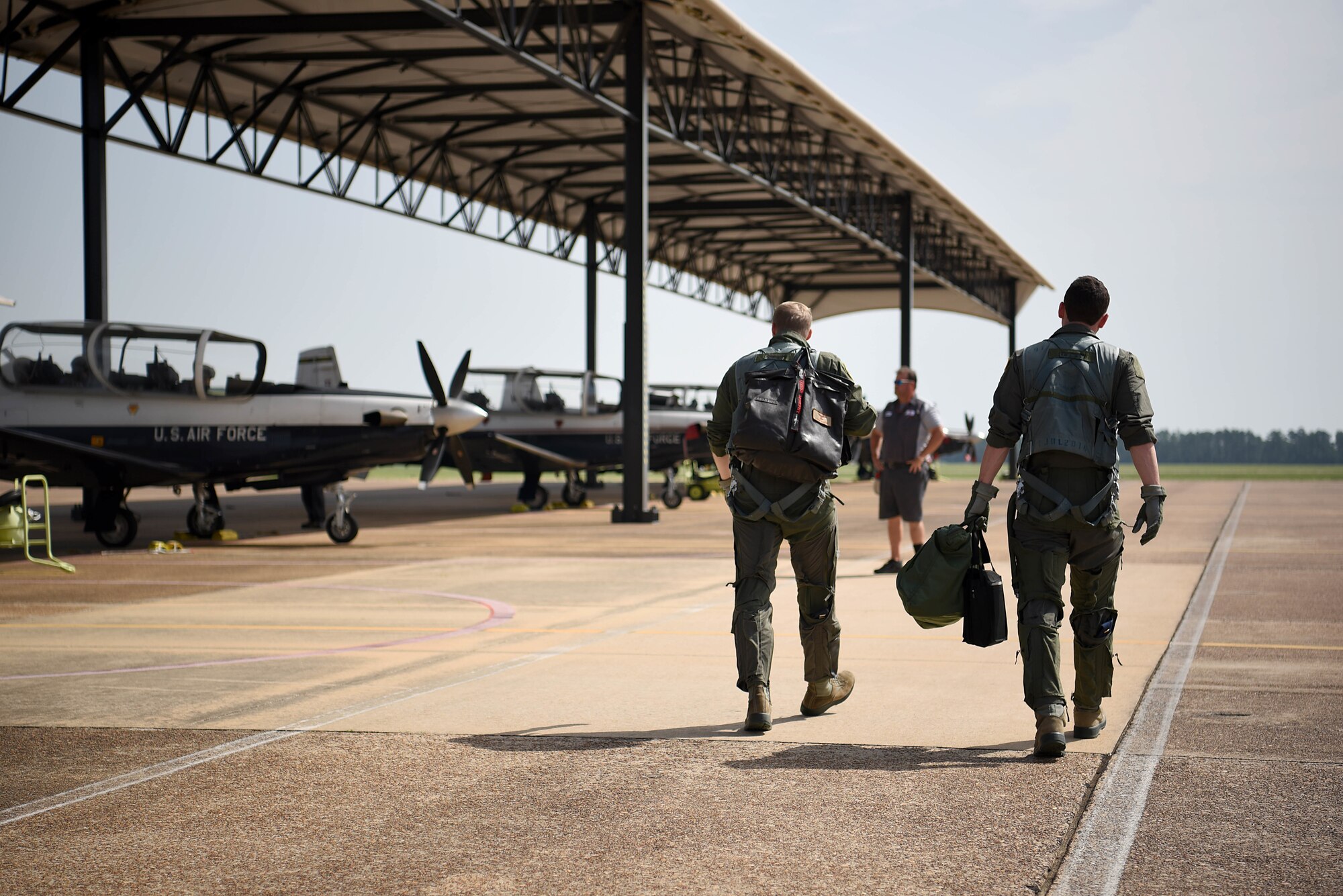 Capt. Conor Murphy, 41st Flying Training Squadron instructor pilot, and 2nd Lt. Cameron Duley, 41st FTS student pilot, step to their assigned aircraft July 2, 2018, on Columbus Air Force Base, Mississippi. The 41st FTS is responsible for training roughly half of all student pilots at the 14th Flying Training Wing. (U.S. Air Force photo by Airman 1st Class Keith Holcomb)