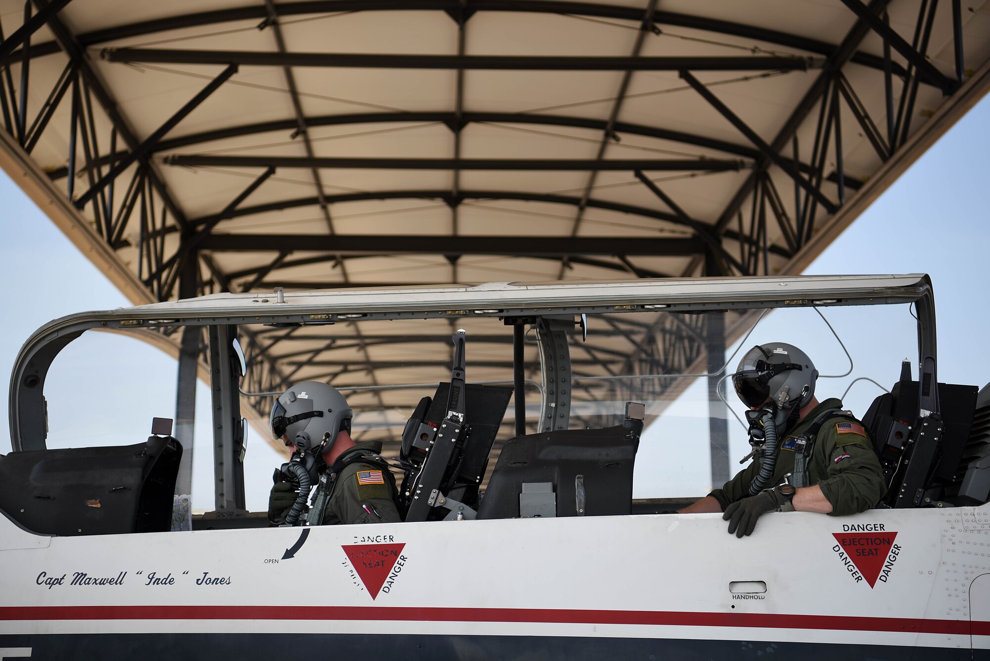 Second Lt. Cameron Duley, 41st Flying Training Squadron student pilot, and Capt. Conor Murphy, 41st FTS instructor pilot, prepare for a sortie July 2, 2018, on Columbus Air Force Base, Mississippi. A T-6 Texan II training mission starting from the mission brief to debrief can take hours and instructor pilots can do up to three flights in one day. (U.S. Air Force photo by Airman 1st Class Keith Holcomb)