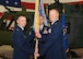 Colonel Joshua Bowman, 582nd Helicopter Group commander, passes the guidon to Lt. Col. Adam Rudolphi, 37th Helicopter Squadron commander, during the 37th HS change of command ceremony July 13, 2018 in Building 1250 on F.E. Warren Air Force Base, Wyo. The ceremony signified the transition of command from Lt. Col. James Cline to Rudolphi. (U.S. Air Force photo by Glenn S. Robertson)