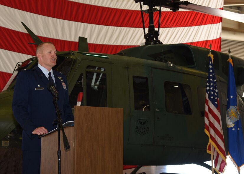 Lieutenant Colonel Adam Rudolphi, 37th Helicopter Squadron commander, speaks to the crowd attending the 37th HS Change of Command July 13, 2018, in Building 1250 on F.E. Warren Air Force Base, Wyo. The ceremony signified the transition of command from Lt. Col. James Cline to Rudolphi. (U.S. Air Force photo by Glenn S. Robertson)