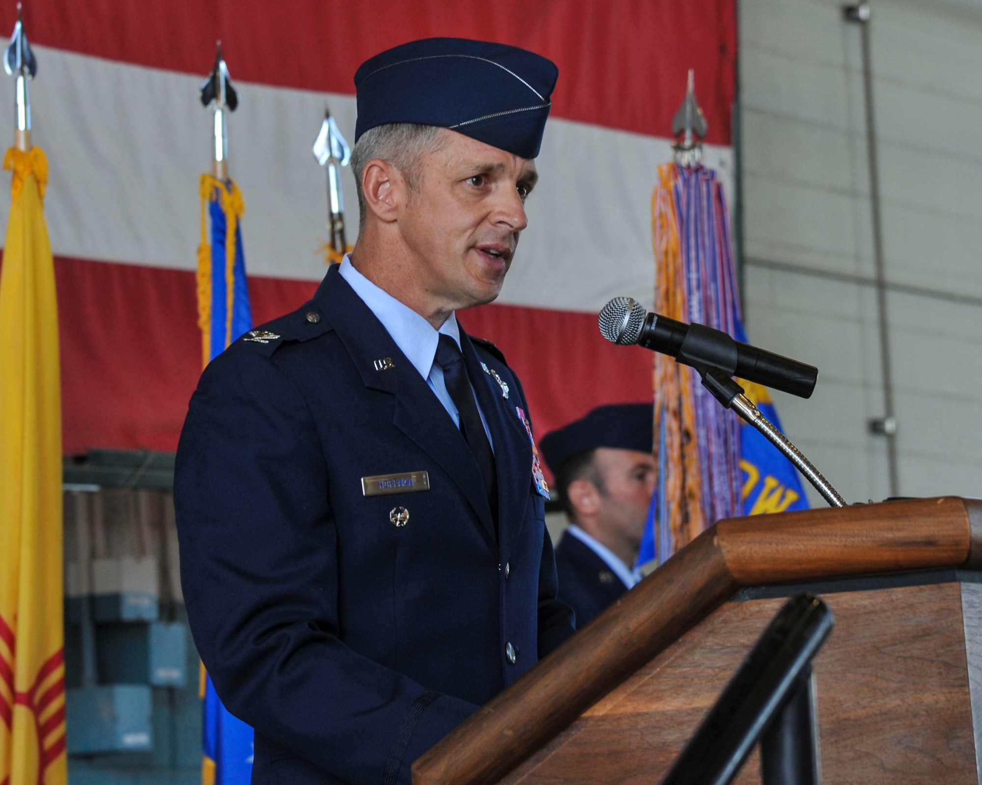 Col. Justin Hoffman speaks during the 58th Special Operations Wing change of command ceremony here July 13. U.S. Air Force  Maj. Gen. Patrick J. Doherty,  commander of the 19th Air Force at Joint Base San Antonio-Randolph, Texas officiated. The ceremony officially recognized U.S. Air Force Col. Brenda P. Cartier, the outgoing 58th SOW Commander and Hoffman as the incoming commander. (U.S. Air Force photo by Jim Fisher)