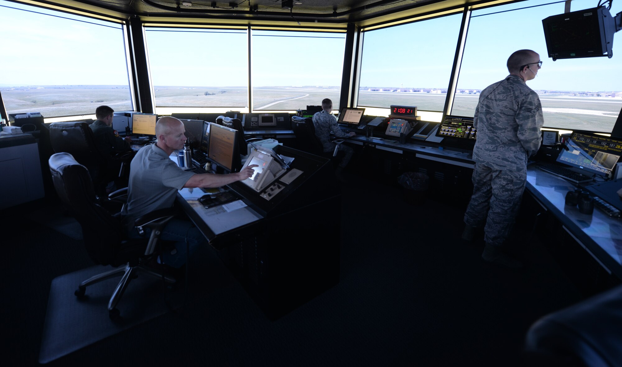 The 28th Operations Support Squadron air traffic control tower’s swing shift team works to coordinate safe travel on the flight line at Ellsworth Air Force Base, S.D., July 10, 2018. Air traffic controllers are qualified to work on both the tower, which coordinates movement on the flight line, and the radar approach control team, which coordinates aircraft movement in the sky. (U.S. Air Force photo by Airman 1st Class Nicolas Z. Erwin)