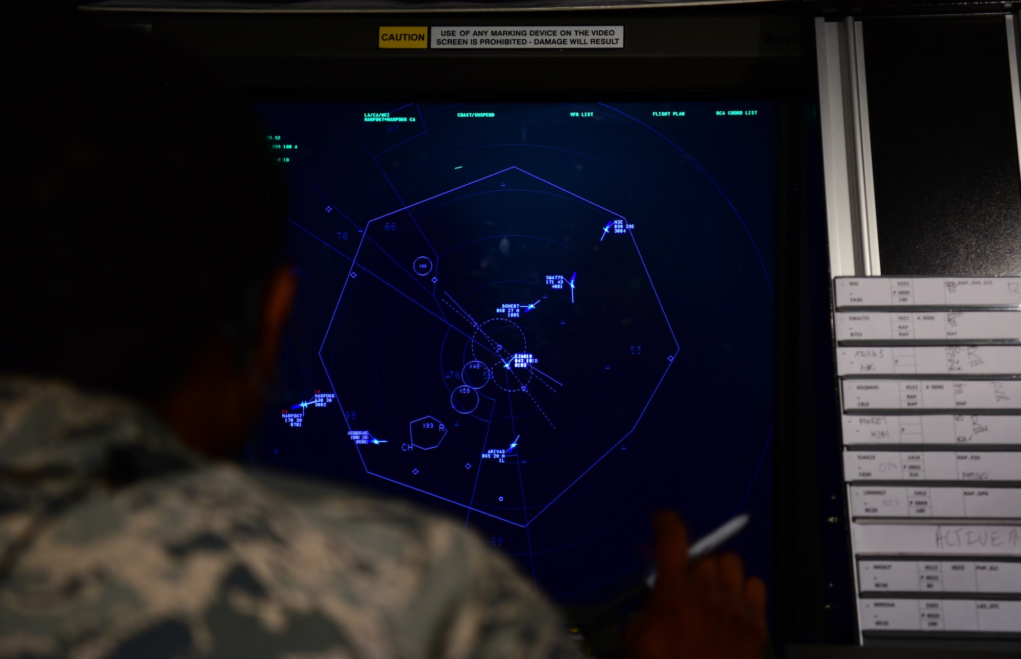 Staff Sgt. Anthony Morgan, the 28th Operations Support Squadron air traffic control standardization and evaluation noncommissioned officer in charge, coordinates flights at a radar approach control terminal at Ellsworth Air Force Base, S.D., July 10, 2018. Air traffic controllers at Ellsworth AFB are qualified on not only their own flight line, but also on the flight line at Minot AFB, North Dakota. (U.S. Air Force photo by Airman 1st Class Nicolas Z. Erwin)