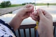 Airman John Ennis, a 28th Bomb Wing Public Affairs broadcast journalist, rigs his fishing rod at Ellsworth Air Force Base, S.D., July 12, 2018. Base fishing permits and South Dakota fishing licenses are available at Outdoor Recreation. (U.S. Air Force photo by Airman 1st Class Nicolas Z. Erwin)