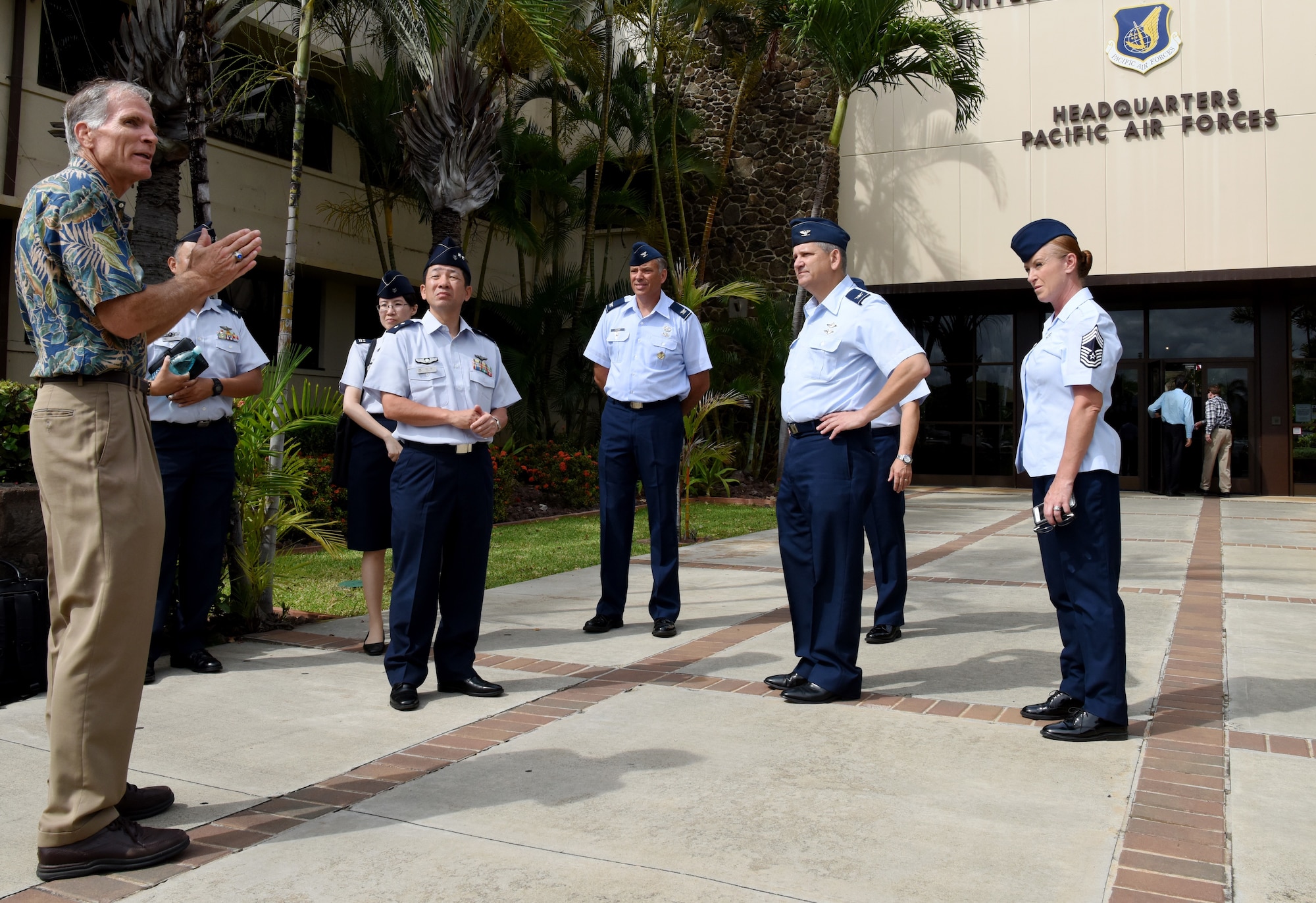 Charles Nicholls, U.S. Pacific Air Forces (PACAF) historian, gives Koukuu Jieitai, Japan Air Self Defense Force, Maj. Gen. Shinya Bekku, Koku Jieitai Surgeon General, a tour of the PACAF Headquarters building at Joint Base Pearl Harbor-Hickam, Hawaii, July 11, 2018.