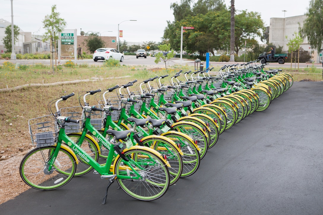 Lime bikes were placed at several locations around Marine Corps Air Station Miramar, including the flightline Marine Corps Exchange minimart as seen on MCAS Miramar Calif., June 9.  MCAS Miramar and LimeBike, a bicycle-sharing company, worked together to bring an environmentally friendly and inexpensive transportation alternative for Marines who lack vehicle transportation or wish to save money.  (U.S. Marine Corps photo by Cpl. Victor Mincy)