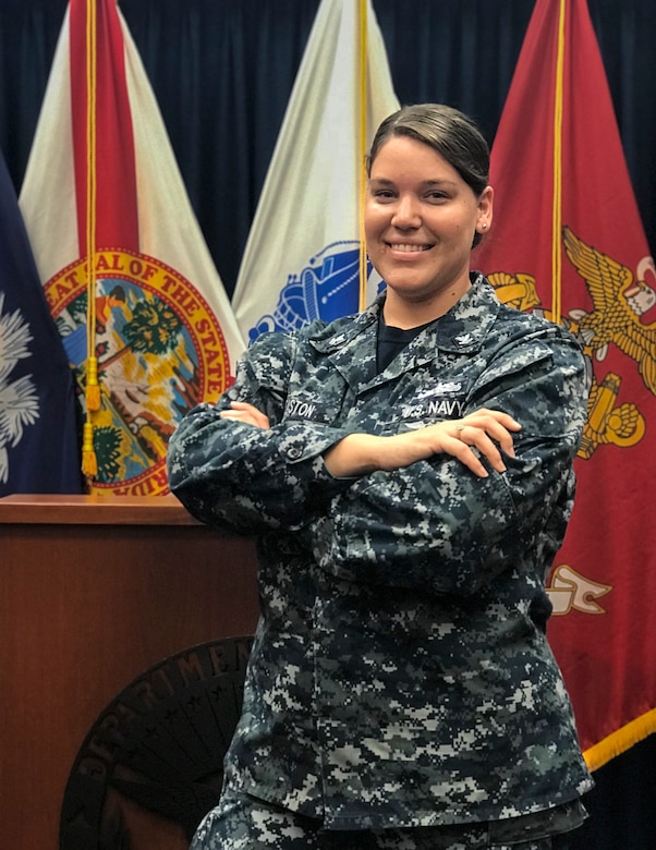 Navy recruiter poses in her office.