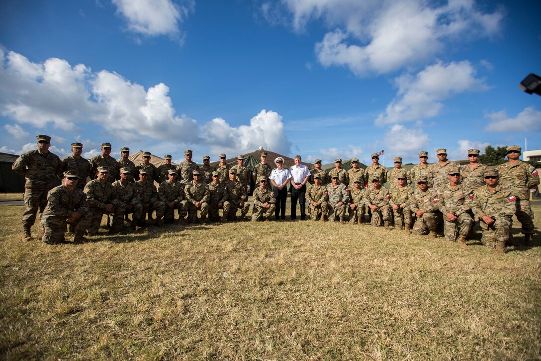 U.S. Marine Corps Brig. Gen. Mark Hashimoto, component commander, Fleet Marine Force; Alberto Espina, Chilean Minister of Defense; Chilean Navy Adm. Julio Leiva, Chilean Navy Commander-in-Chief, and Chilean marines pose for a photo during the Rim of the Pacific (RIMPAC) exercise on Marine Corps Base Hawaii July 11, 2018. RIMPAC provides high-value training for task-organized, highly capable Marine Air-Ground Task Force and enhances the critical crisis response capability of U.S. Marines in the Pacific.