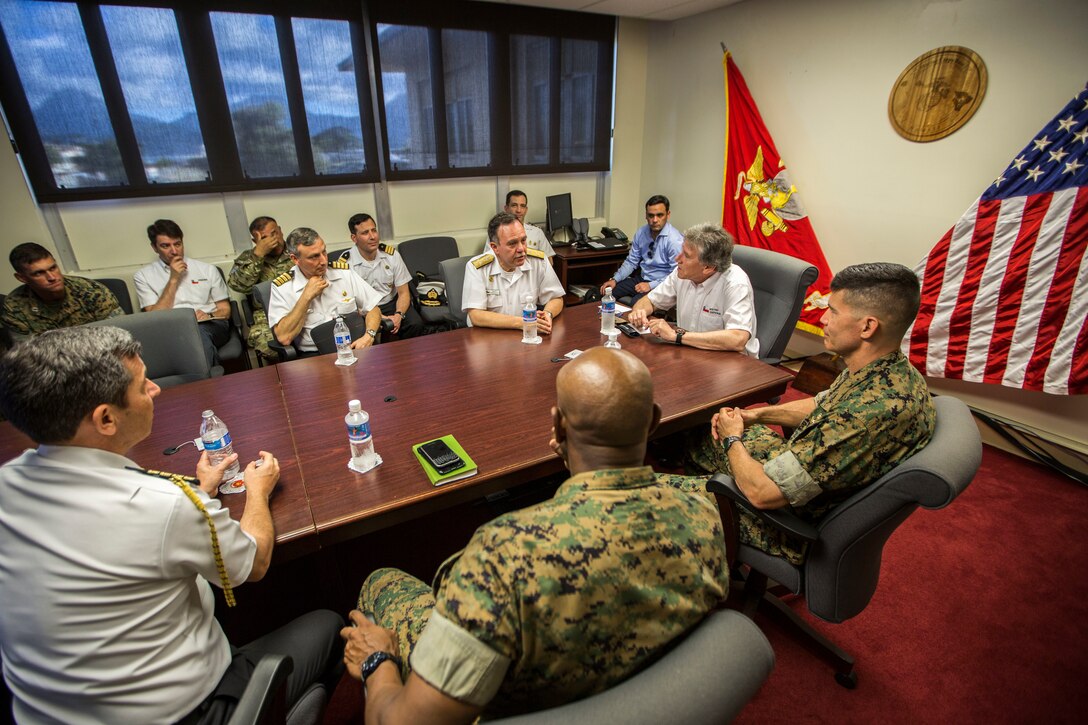 180711-M-RA909-1126 MARINE CORPS BASE HAWAII (July 11, 2018) Chilean Adm. Julio Leiva, Chilean Navy Commander-in-Chief, speaks to U.S. Marine Corps Brig. Gen. Mark Hashimoto, component commander, Fleet Marine Force, during the Rim of the Pacific (RIMPAC) exercise on Marine Corps Base Hawaii July 11, 2018. RIMPAC provides high-value training for task-organized, highly capable Marine Air-Ground Task Force and enhances the critical crisis response capability of U.S. Marines in the Pacific.