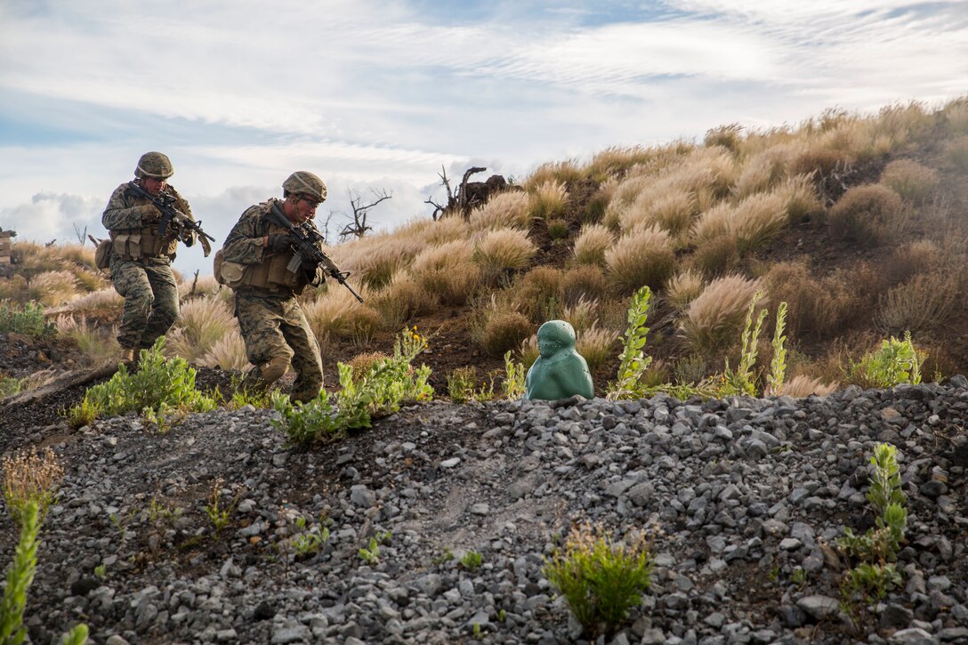U.S. Marines with Bravo Company, 1st Battalion, 3rd Marine Regiment, secure an enemy position during a live-fire training event as part of Rim of the Pacific (RIMPAC) exercise at Pohakuloa Training Area, Hawaii, July 13, 2018. The live-fire training integrated fire teams from other RIMPAC participants with U.S. Marines, which provides high-value training for task-organized, highly capable Marine Air-Ground Task Force and enhances the critical crisis response capability of U.S. Marines in the Pacific. Twenty-five nations, 46 ships, five submarines, about 200 aircraft and 25,000 personnel are participating in RIMPAC from June 27 to Aug. 2 in and around the Hawaiian Islands and Southern California. (U.S. Marine Corps photo by Lance Cpl. Adam Montera)