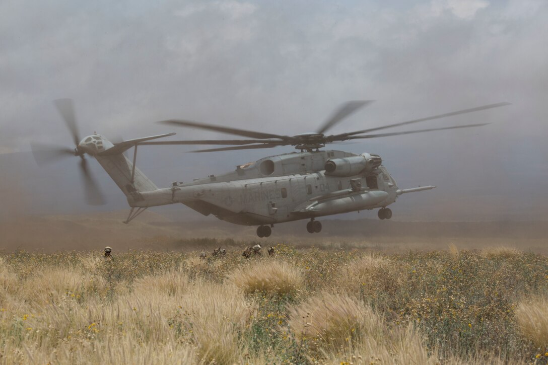 A U.S. Marine Corps CH-53E Super Stallion helicopter takes off after dropping off Marines during a noncombatant evacuation operation (NEO) training event as part of Rim of the Pacific (RIMPAC) exercise at Pohakuloa Training Area, Hawaii July 12, 2018. A NEO is conducted to evacuate citizens whose lives are in danger. RIMPAC provides high-value training for task-organized, highly capable Marine Air-Ground Task Force and enhances the critical crisis response capability of U.S. Marines in the Pacific.