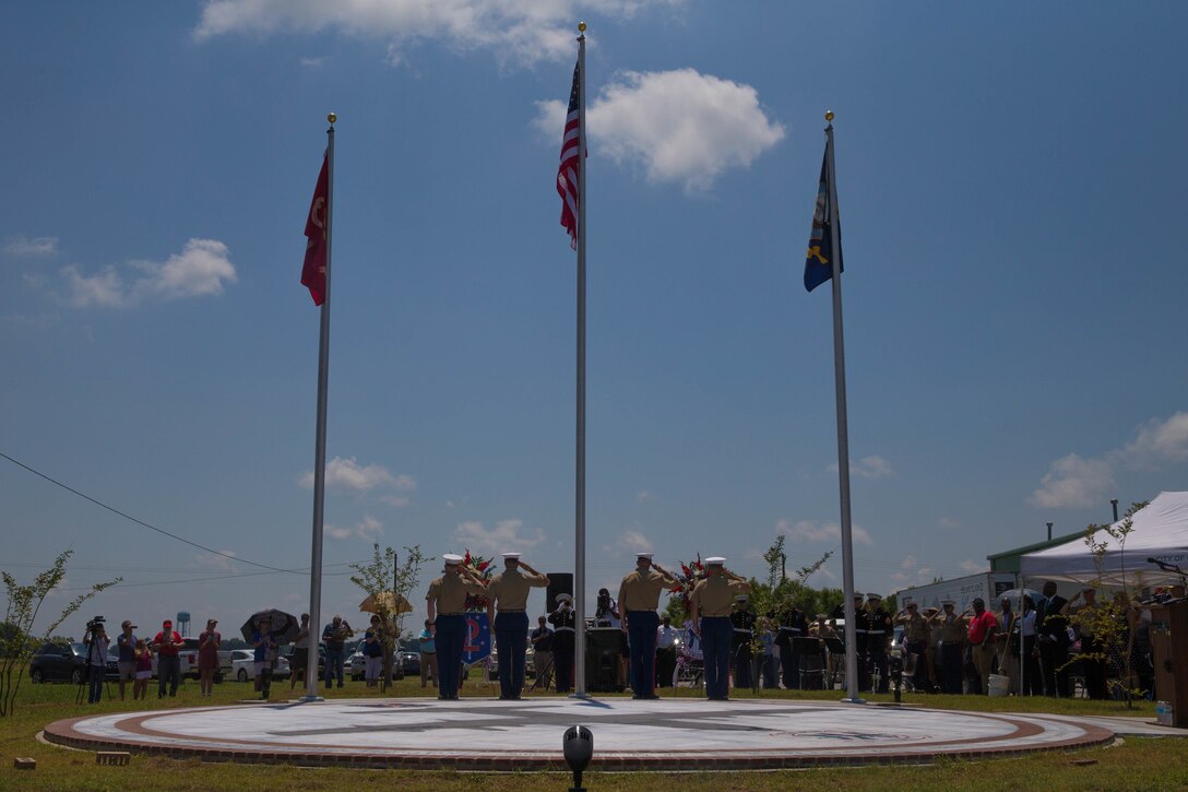 U.S. Marines with Marine Corps Special Operations Command and Marine Aerial Refueler Transport Squadron 452, Marine Aircraft Group 49, 4th Marine Aircraft Wing, conduct the laying of the memorial wreaths at the Memorial Marker dedicated to honor the sacrifice of the fallen passengers and crew of Yanky 72, during the Memorial Ceremony, July 14, 2018. The Yanky 72 Memorial Ceremony was held to remember and honor the ultimate sacrifices made by the fallen Marines and Sailor of VMGR-452 and Marine Corps Special Operations Command. (U.S. Marine Corps photo by Lance Cpl. Samantha Schwoch/released)