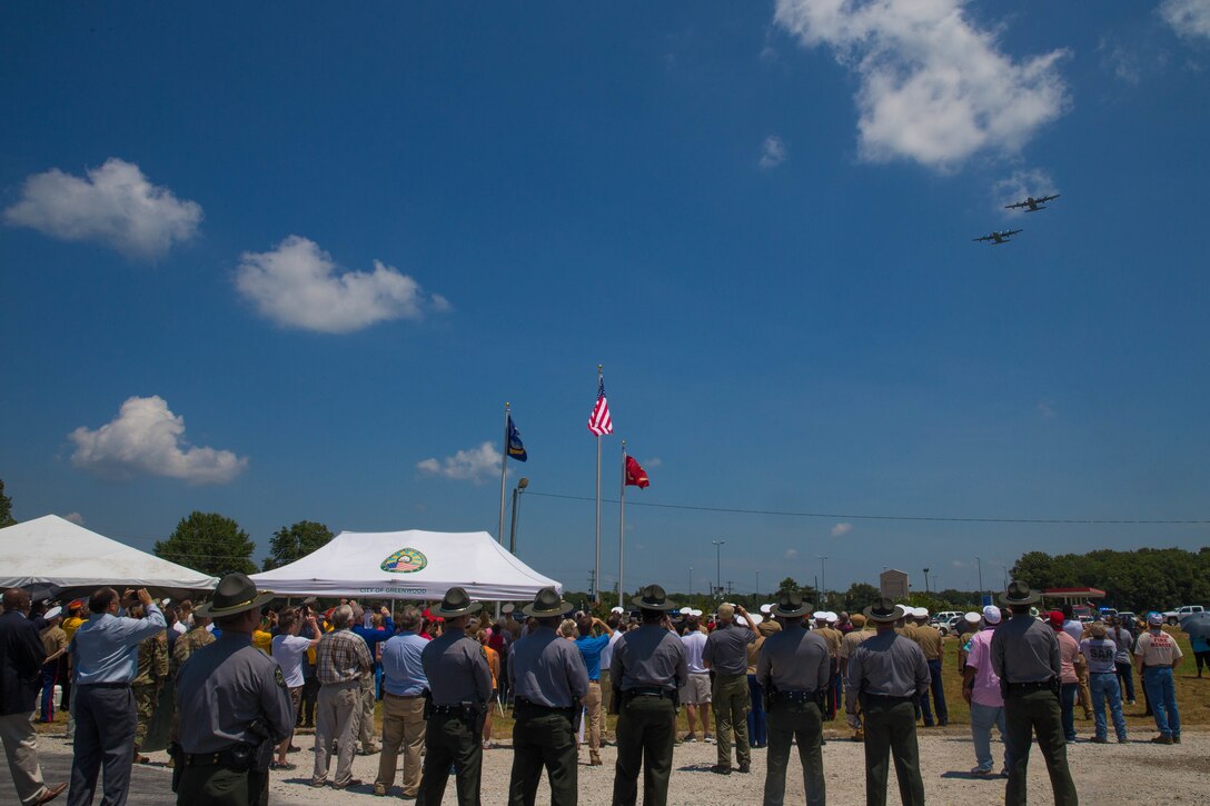 Marine Aerial Refueler Transport Squadron 452, Marine Aircraft Group 49, 4th Marine Aircraft Wing, conducts a fly over after the dedications of the Memorial Marker honoring the sacrifice of the fallen passengers and crew of Yanky 72, during the Memorial Ceremony, July 14, 2018. The Yanky 72 Memorial Ceremony was held to remember and honor the ultimate sacrifices made by the fallen Marines and Sailor of VMGR-452 and Marine Corps Special Operations Command. (U.S. Marine Corps photo by Lance Cpl. Samantha Schwoch/released)