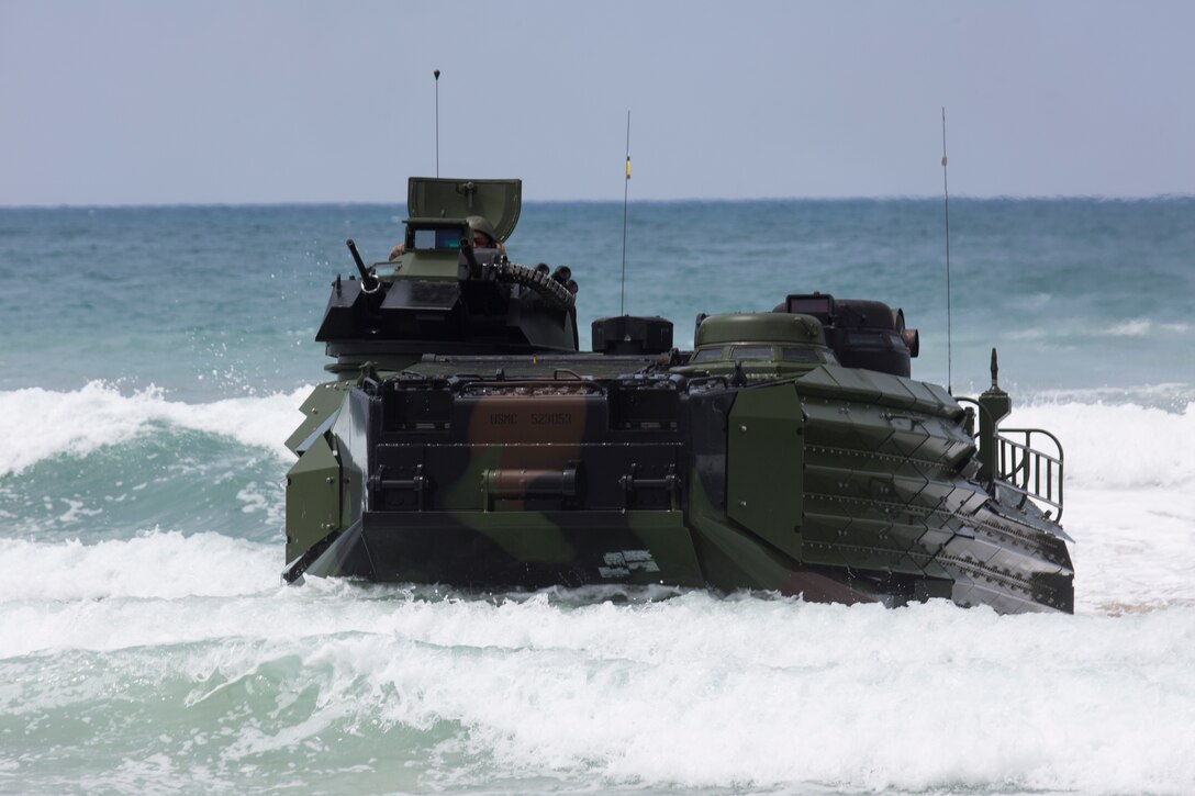A U.S. Marine Corps AAV-P7/A1 assault amphibious vehicle approaches the shore during an amphibious raid as part of Rim of the Pacific (RIMPAC) exercise on Marine Corps Base Camp Pendleton, California, July 13, 2018. This evolution provided an opportunity for participating nations to share best practices which included loading and unloading drills as well as squad attacks. RIMPAC demonstrates the value of amphibious forces and provides high-value training for task-organized, highly capable Marine Air-Ground Task Forces enhancing the critical crisis response capability of U.S. forces and partners globally.