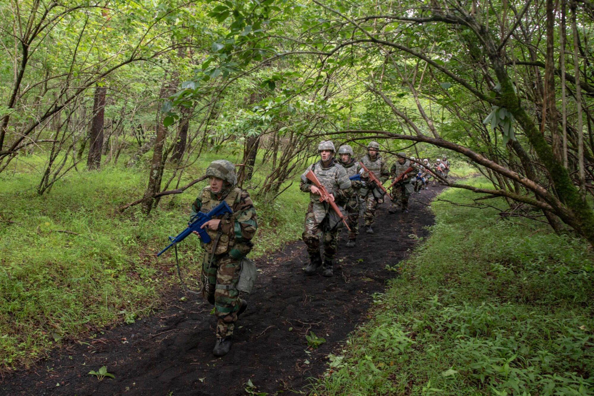 Airmen with the 374th Airlift Wing perform individual team movement