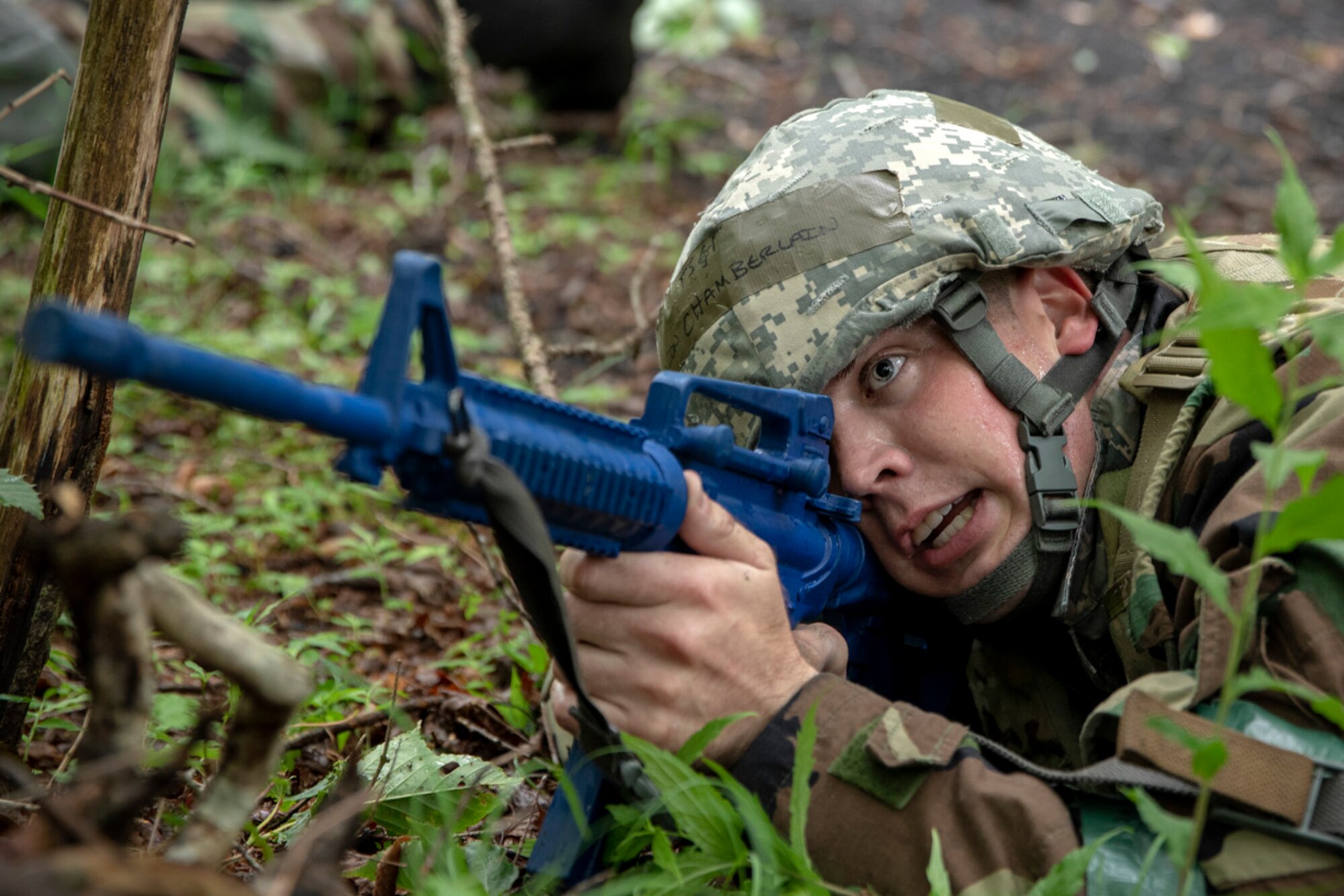 Tech. Sgt. Aaron Chamberlain, 374th Maintenance Group base engine manager, provides security during an individual team movement