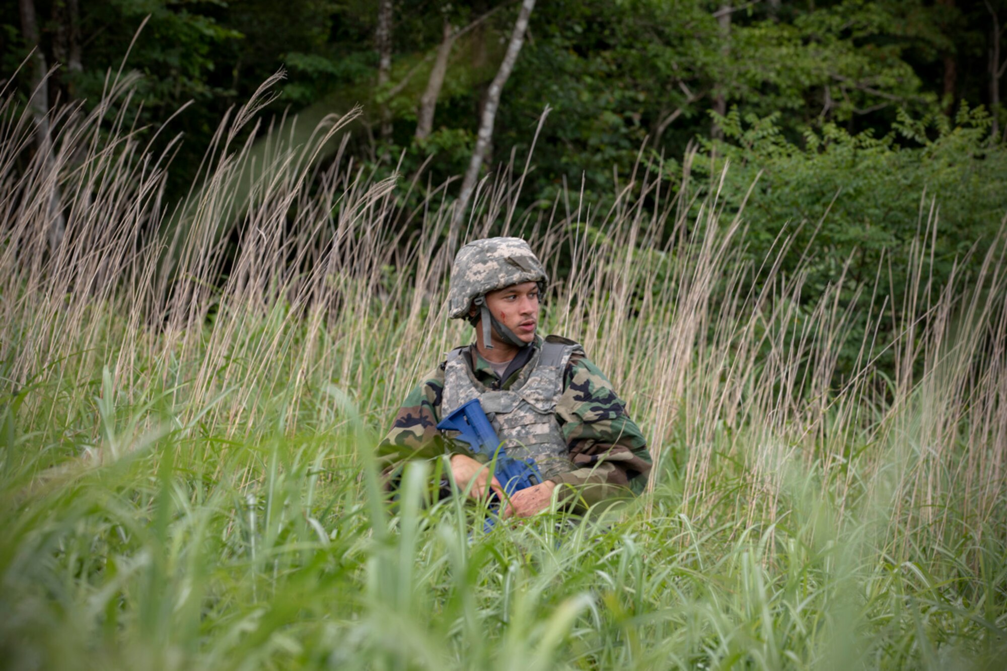 Airman 1st Class Ramon Dickerson, 374th Force Support Squadron postal clerk, performs individual team movement during Chemical, Biological, Radiological and Nuclear training at Combined Arms Training Center Camp Fuji