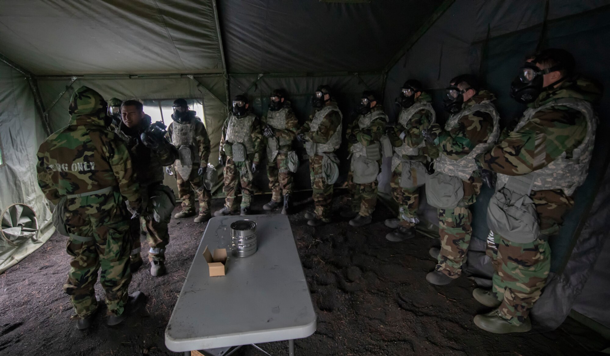 Airmen with the 374th Airlift Wing are exposed to CS gas inside the gas mask confidence chamber