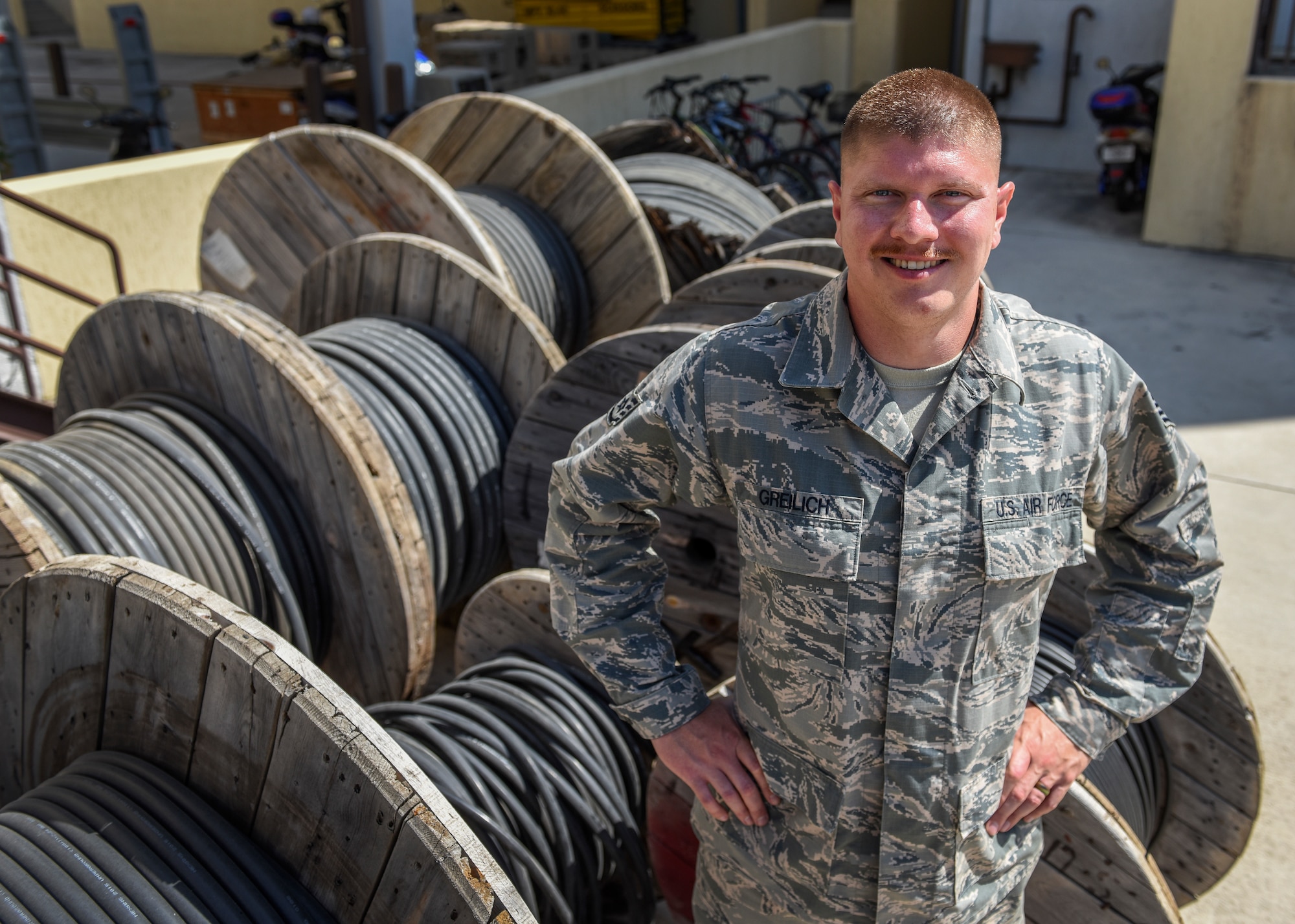 U.S. Air Force Staff Sgt. Brian Greilich, 39th Communications Squadron cable and antenna systems technician, stands in front of cables at Incirlik Air Base, Turkey, July 6, 2018.