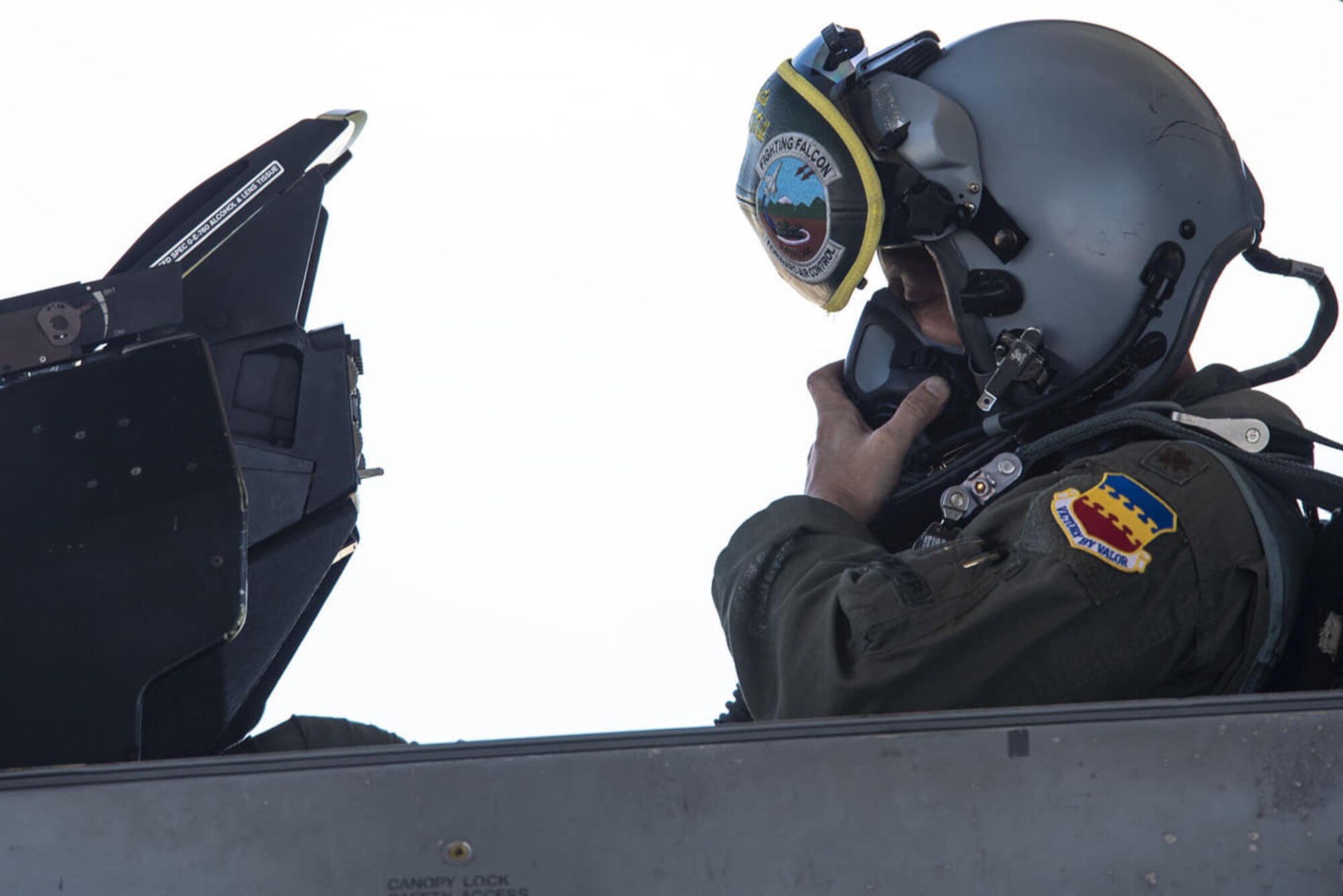 U.S. Air Force Maj. David Paulus, 77th Fighter Squadron (FS) assistant to the director of operations, adjusts his oxygen mask at Shaw Air Force Base, S.C., July, 9, 2018.