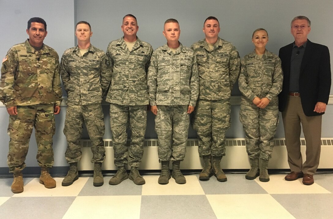 Executive Director of the Air National Guard, Daniel E. Bishop, recognized members of the 157th Air Refueling Wing with his coin during a base all-call on July 12, 2018 at Pease Air National Guard Base, N.H. Bishop toured the base and participated in planning meetings during the final day of a three-day workshop which brought together members of the geographically dispersed KC-46 conversion team. (N.H. Air National Guard photo by Col. William Davis)