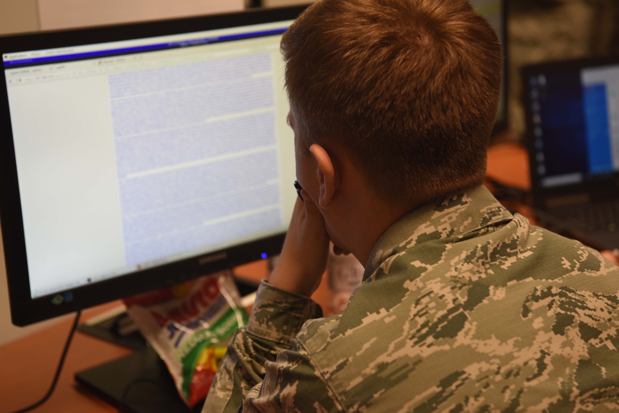 U.S Air Force Airman 1st Class Oard Keith, 52nd Communications Squadron client systems technician looks for a solution to a simulated cyber-attack on Ramstein Air Base, Germany, July 12, 2018. Exercise Tacet Venari split Airmen into two teams to practice attacking and defending vulnerable systems on a simulated network.