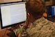 U.S Air Force Airman 1st Class Oard Keith, 52nd Communications Squadron client systems technician looks for a solution to a simulated cyber-attack on Ramstein Air Base, Germany, July 12, 2018. Exercise Tacet Venari split Airmen into two teams to practice attacking and defending vulnerable systems on a simulated network.