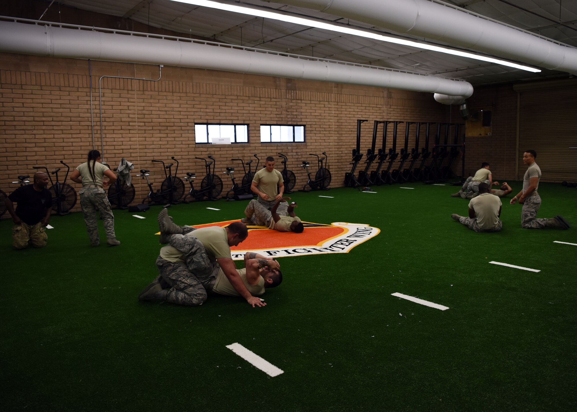 Members of the 56th Security Forces Squadron practice a variety of self-defense maneuvers at the Tactical Integrated Training and Nutrition Arena July 12, 2018, at Luke Air Force Base, Ariz.