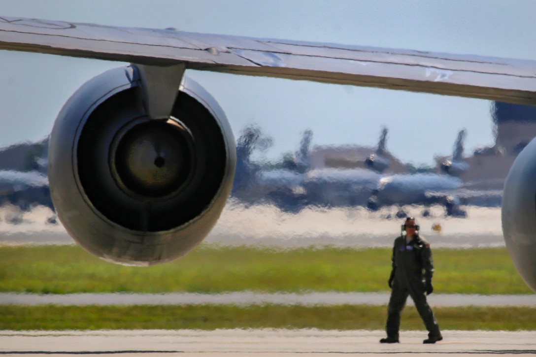 An airman prepares a KC-135R Stratotanker before takeoff.