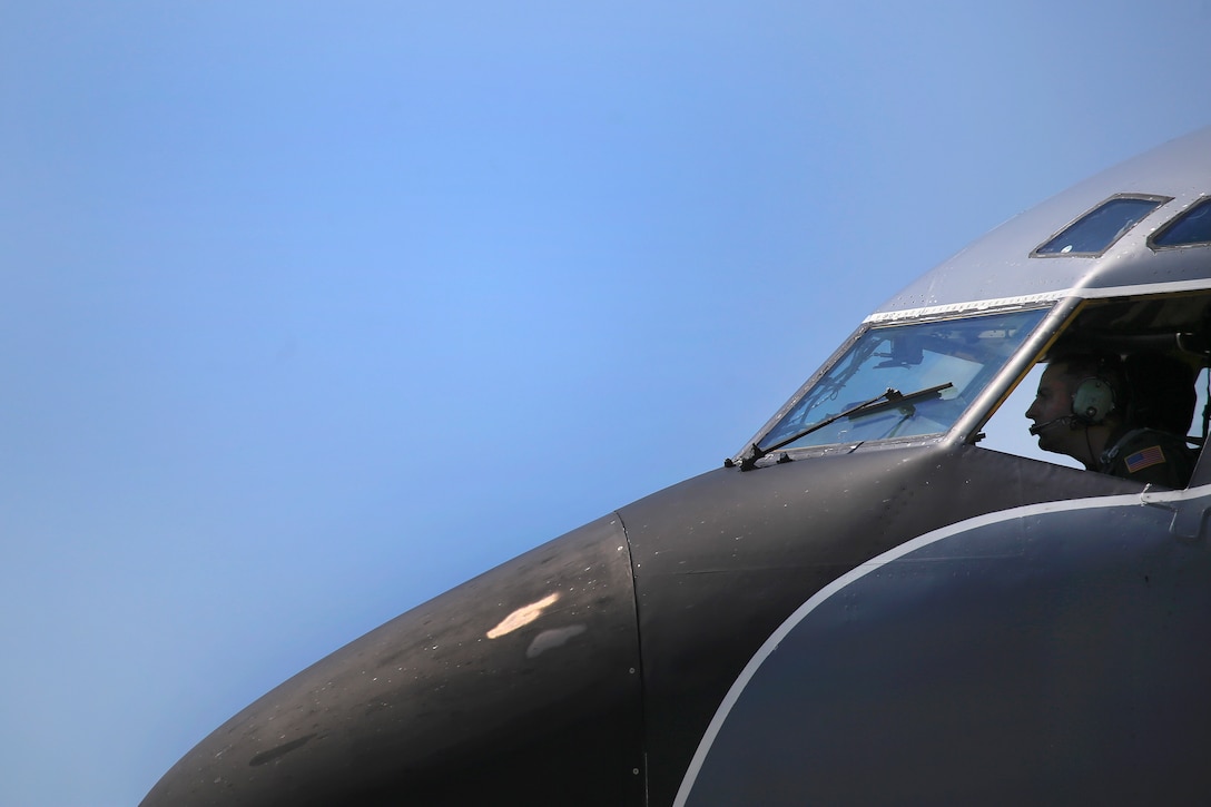 An Air Force pilot prepares a KC-135R Stratotanker before takeoff.