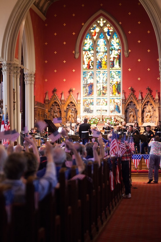 Attendees of the 20th Annual Patriotic Music Festival wave American flags during the Marine Forces Reserve Band’s jazz arrangement of “Stars and Stripes Forever,” a piece originally composed by John Philip Sousa, at the Trinity Episcopal Church, New Orleans on July 1, 2018. The music festival is one of multiple concerts performed by the band for their Independence Day concert series. (U.S. Marine Corps photo by Lance Cpl. Tessa D. Watts)